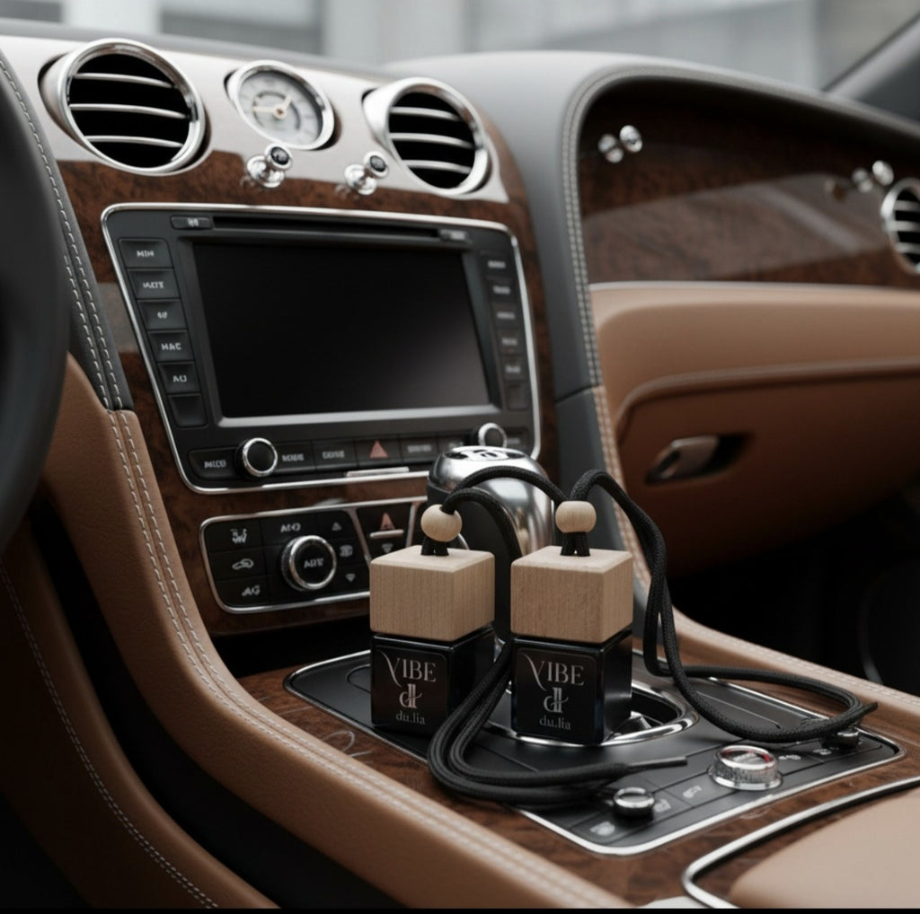 VIBE car perfume with glowing amber tones symbolizing smooth woods and tobacco warmth.